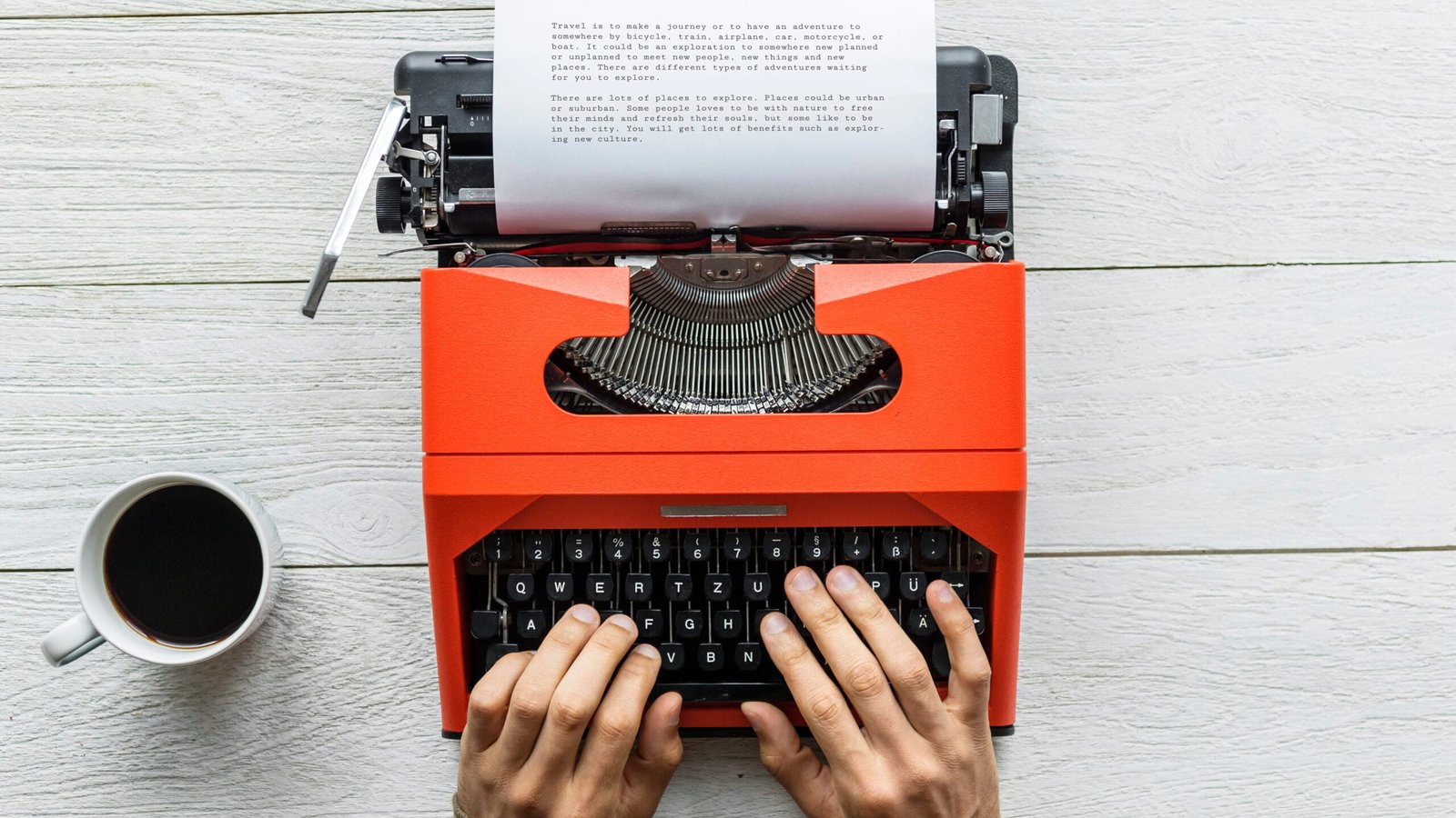 Aerial view of a man typing on a retro typewriter